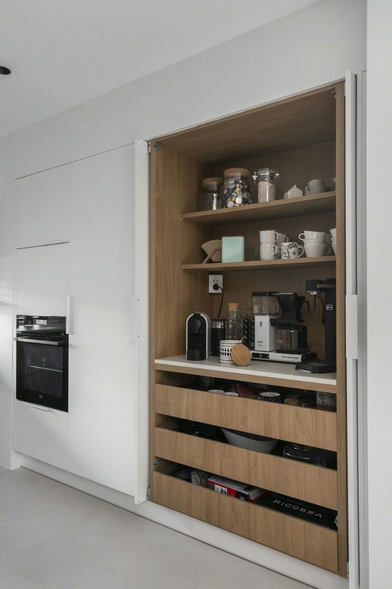 Appliance garage with pocket doors