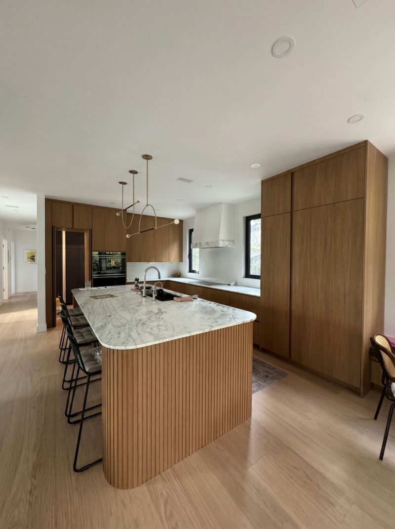 Curved island with fluted panels