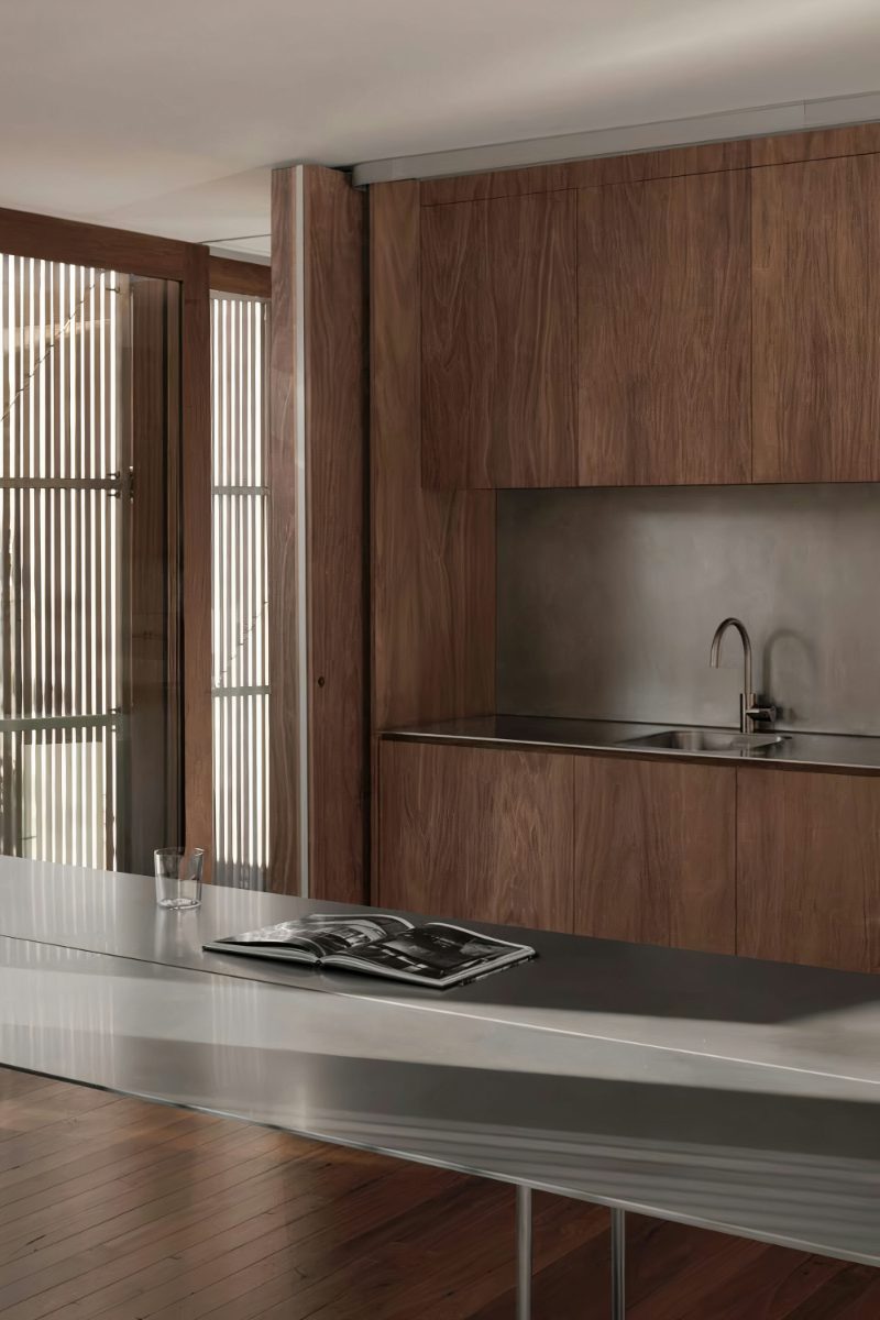 Stainless steel countertop in wooden kitchen